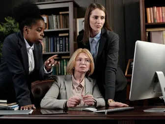 Lawyers watching computer